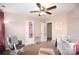 Bedroom featuring a crib, rocking chair, and rainbow themed decor at 184 Settlers Grove Ln # L7, Salisbury, NC 28146