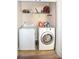 Laundry room featuring a washer and dryer with overhead shelving at 184 Settlers Grove Ln # L7, Salisbury, NC 28146