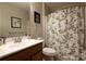 Functional bathroom with a single vanity and a shower with a decorative curtain at 1910 Colony Line Ct, Charlotte, NC 28210