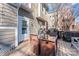 An outdoor deck with table and chairs, perfect for relaxing or entertaining and a grill for outdoor cooking at 1921 Kenilworth Ave, Charlotte, NC 28203