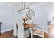 Elegant dining area with a modern chandelier and a charming floral arrangement at 1921 Kenilworth Ave, Charlotte, NC 28203