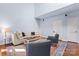 Open living room featuring hardwood floors, neutral walls, and modern decor at 1921 Kenilworth Ave, Charlotte, NC 28203