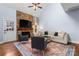 Bright living room featuring a stone fireplace, vaulted ceilings, and hardwood floors at 1921 Kenilworth Ave, Charlotte, NC 28203