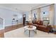 Cozy living room featuring a comfortable leather sofa and hardwood floors at 1921 Kenilworth Ave, Charlotte, NC 28203