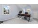A comfortable office space with a modern desk, ergonomic chair, and natural light from two windows at 1921 Kenilworth Ave, Charlotte, NC 28203