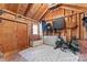 Rustic shed interior, with exposed wood walls and a variety of storage options and fitness equipment at 1921 Kenilworth Ave, Charlotte, NC 28203