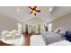 Well-lit bedroom features hardwood flooring, vaulted ceilings, and a cozy seating area, creating a relaxing retreat at 2721 Dora Dr, Charlotte, NC 28215