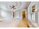 Bright bedroom with tiled floor, ceiling fan, and ample closet space at 2721 Dora Dr, Charlotte, NC 28215