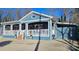 Charming home with blue siding, covered porch, and well-manicured landscaping, perfect for outdoor living at 2721 Dora Dr, Charlotte, NC 28215