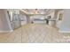 Spacious kitchen with stainless steel appliances, tile flooring, and a large island at 2721 Dora Dr, Charlotte, NC 28215