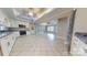 Open-concept kitchen with granite countertops, stainless appliances, and tile flooring at 2721 Dora Dr, Charlotte, NC 28215