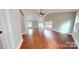Spacious open concept living room features hardwood floors, neutral paint, and lots of natural light at 2721 Dora Dr, Charlotte, NC 28215