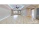 Bright living room with tile flooring, recessed lighting, and a ceiling fan at 2721 Dora Dr, Charlotte, NC 28215