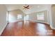 Large, open living room boasts beautiful hardwood floors, vaulted ceiling and an abundance of natural light at 2721 Dora Dr, Charlotte, NC 28215
