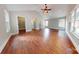 Bright main bedroom with hardwood floors, fan, vaulted ceiling, and recessed lighting at 2721 Dora Dr, Charlotte, NC 28215