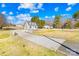 Ariel view of house and a long driveway surrounded by a bright sky with a view of other houses at 2927 Forest Hills Cir, Rock Hill, SC 29732
