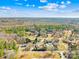 Aerial view of houses nestled within mature trees, offering a sense of seclusion, privacy and proximity to nature under clear skies at 2927 Forest Hills Cir, Rock Hill, SC 29732