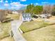Charming two-story home with dormer windows, a long driveway, and lush landscaping from above at 2927 Forest Hills Cir, Rock Hill, SC 29732