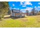 Backyard with a covered porch and well-maintained lawn at 2927 Forest Hills Cir, Rock Hill, SC 29732