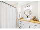 Stylish bathroom features a modern vanity, round mirror, and walk-in shower at 2927 Forest Hills Cir, Rock Hill, SC 29732