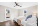 Bright bedroom with wood floors, a ceiling fan, and natural light from two windows at 2927 Forest Hills Cir, Rock Hill, SC 29732