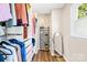 Walk-in closet with wood floors, offering ample storage with shelving, rods, and a convenient shoe rack at 2927 Forest Hills Cir, Rock Hill, SC 29732