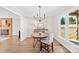 Bright dining area features wood floors, a modern chandelier, and abundant natural light at 2927 Forest Hills Cir, Rock Hill, SC 29732