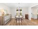 Dining area boasts modern chandelier, ample natural light, and wood-look floors at 2927 Forest Hills Cir, Rock Hill, SC 29732