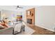 Bright living room with a brick fireplace, wood floors, and comfortable gray sectional sofa at 2927 Forest Hills Cir, Rock Hill, SC 29732