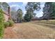 Expansive backyard, framed by mature trees, offering a serene and private outdoor space at 2968 Robinwood Rd, Gastonia, NC 28054