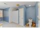 Bright bathroom with a window, shower with curtain, toilet and tile flooring at 2968 Robinwood Rd, Gastonia, NC 28054