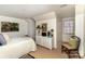 Cozy bedroom with wicker furnishings, lamps, and unique decor accents at 2968 Robinwood Rd, Gastonia, NC 28054
