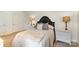 Bright bedroom featuring natural light, a decorative headboard, and two nightstands at 2968 Robinwood Rd, Gastonia, NC 28054