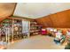 Large bonus room with built-in shelving, carpeted flooring, and ample space for various activities at 2968 Robinwood Rd, Gastonia, NC 28054