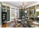 Formal dining room with elegant wallpaper, chandelier, and glass-top dining table at 2968 Robinwood Rd, Gastonia, NC 28054