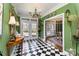 Elegant entryway with black and white tile flooring, chandelier, and views into the dining room at 2968 Robinwood Rd, Gastonia, NC 28054