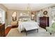 Serene main bedroom featuring a chandelier, hardwood floors, and a soothing color palette at 2968 Robinwood Rd, Gastonia, NC 28054