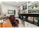 Home office with built-in shelves, black desk, and an elegant leather chair at 2968 Robinwood Rd, Gastonia, NC 28054