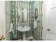 Stylish powder room featuring unique wallpaper, a pedestal sink, and elegant fixtures at 2968 Robinwood Rd, Gastonia, NC 28054