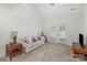 Bright living room with vaulted ceilings, ceiling fan, and french doors to outside at 334 Valley Brook Se Ln, Concord, NC 28025