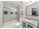 Bright bathroom featuring a shower over tub combination, and granite countertop vanity at 351 W 7Th St, Charlotte, NC 28202