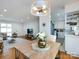 Open floor plan from dining room featuring natural light, a dining table and easy access to living room at 4310 Randolph Rd, Charlotte, NC 28211
