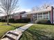 Charming one story home with a brick facade, manicured lawn and inviting entrance at 4310 Randolph Rd, Charlotte, NC 28211