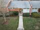 Street-level view of an inviting one-story home with well maintained landscaping at 4310 Randolph Rd, Charlotte, NC 28211