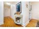Inviting hallway with warm hardwood floors and stylish decor, leading to other rooms at 4310 Randolph Rd, Charlotte, NC 28211
