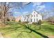 Beautiful white two-story home with well-manicured lawn, lovely trees, and great curb appeal at 4317 Sequoia Red Ln, Charlotte, NC 28226