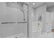 Modern bathroom featuring a glass-enclosed shower and soaking tub at 435 S Tryon St # 610, Charlotte, NC 28202