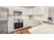 Elegant kitchen featuring stainless steel appliances and white subway tile backsplash at 503 Georgetown Nw Dr, Concord, NC 28027