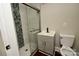 Modern bathroom featuring a sleek glass shower, vanity with cabinet, and updated fixtures at 506 E Ridge St, Kings Mountain, NC 28086