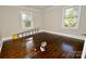 This bedroom has hardwood floors and natural light from two windows, perfect for relaxing at 506 E Ridge St, Kings Mountain, NC 28086